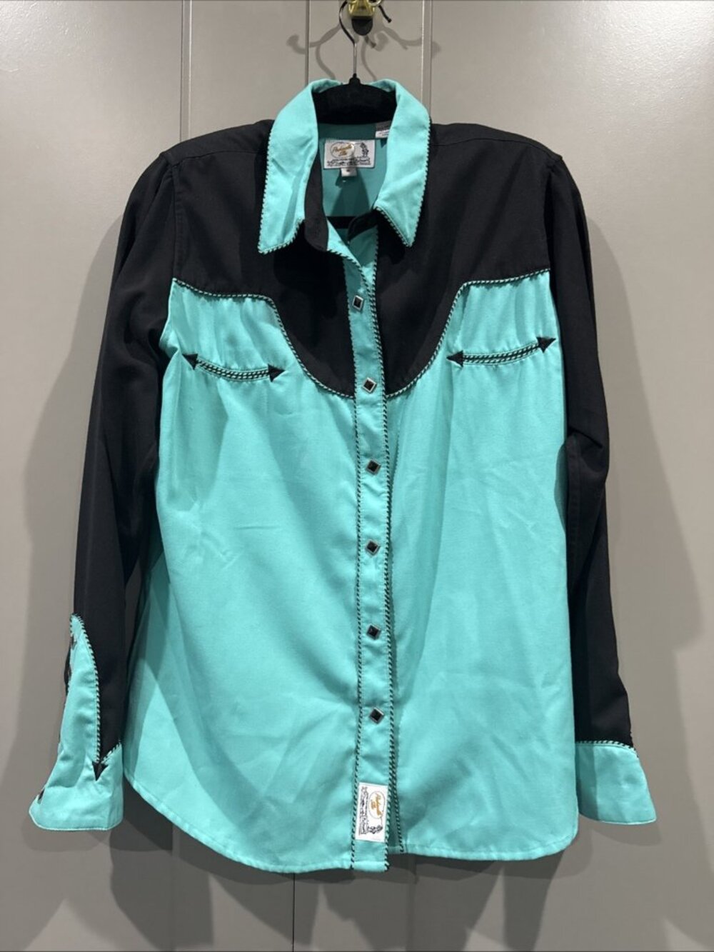 This Women's Vintage Panhandle Slim Black & Turquoise Diamond Pearl Snap Western